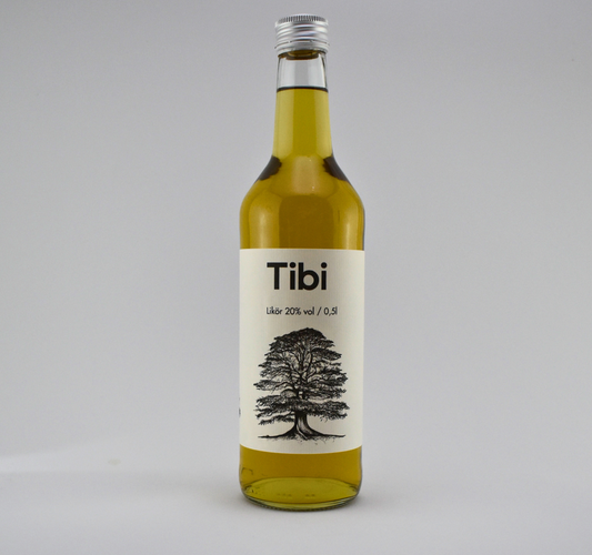 Tibi 20% vol. Waldmeisterlikör in Flasche, ideal pur oder auf Eis, handgefertigt mit Alpenblick.